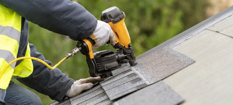 Roofer Doing Roof Repair in Macomb County