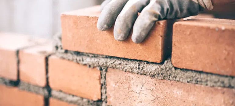 Closeup of building brick wall with mortar