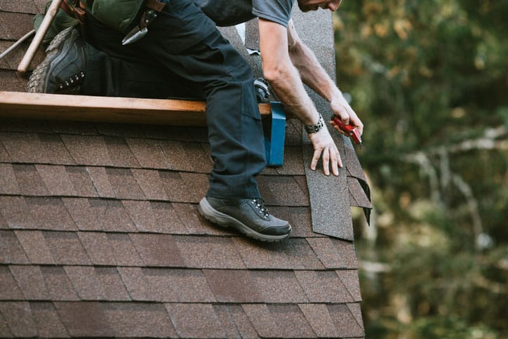 Roofing Contractor Installing Shingles
